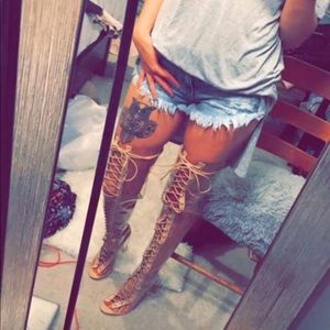 Clear knee high boots.